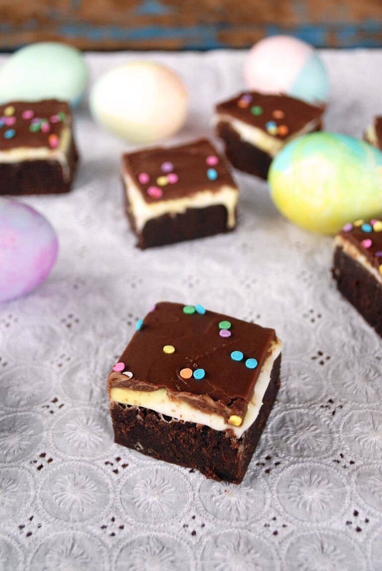 creme egg brownie squares on white tablecloth