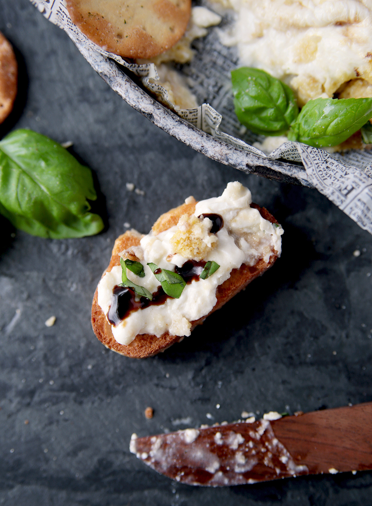 crostini topped with burrata and balsamic and basil