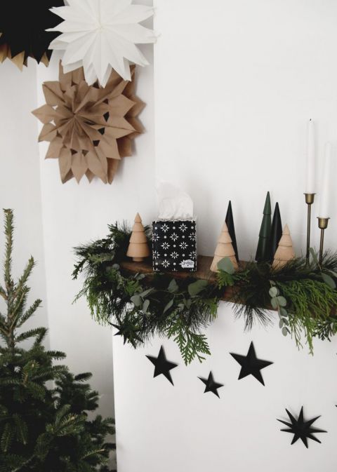 mantel with holiday decor and star decorations