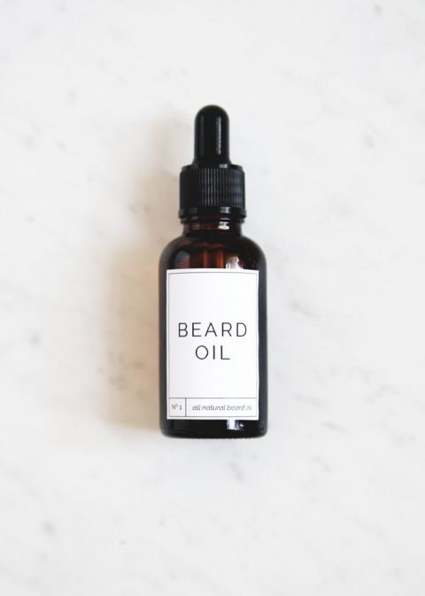 amber glass dropper bottle of beard oil