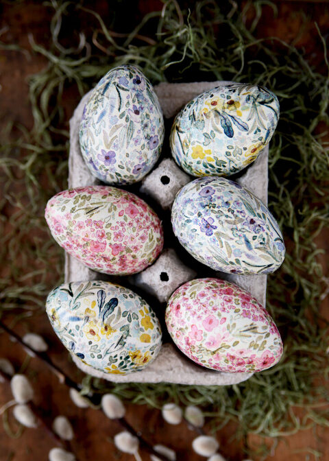 6 floral easter eggs in egg carton sitting on green moss
