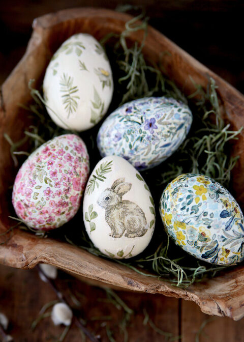 paper napkin decoupage easter eggs on green moss in wood bowl