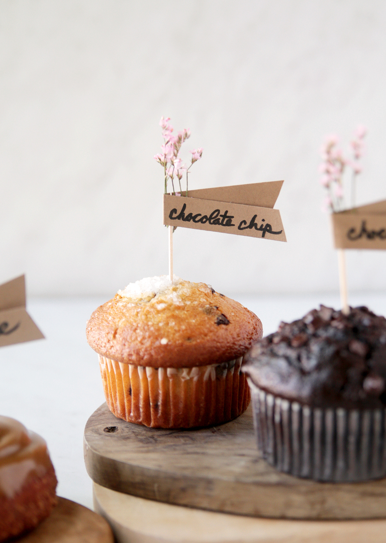 muffin with pink floral food label stuck in the top