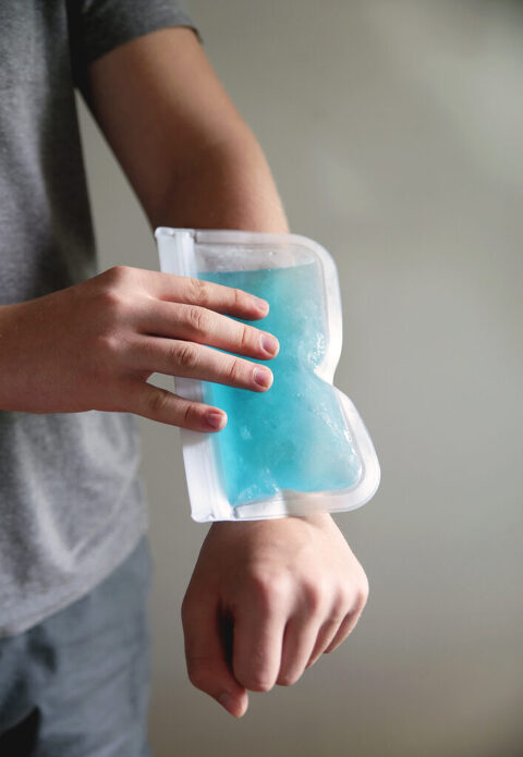 homemade gel ice pack on arm of young boy