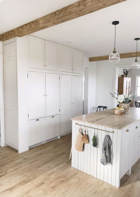 kitchen with wall of beige cabinets and large kitchen island