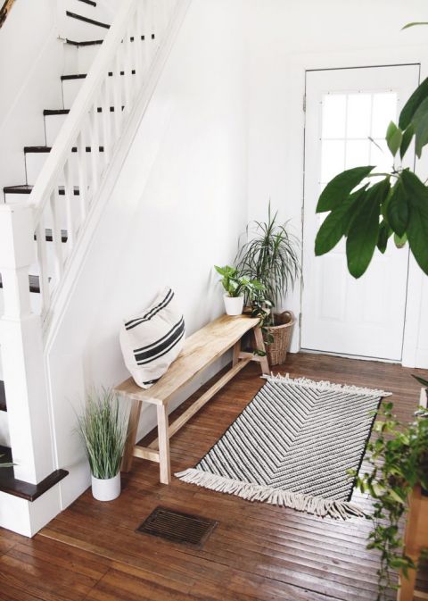 wood bench by stairs with plants