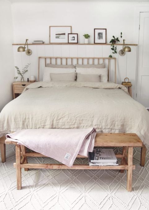neutral bedroom with skinny bench at end of bed