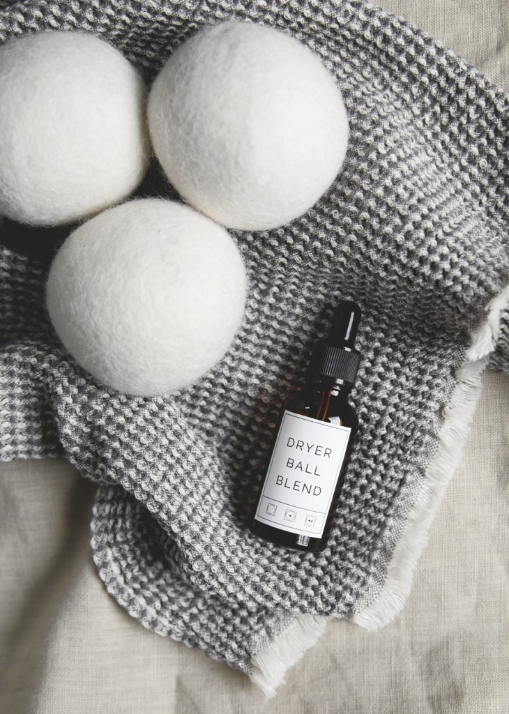 wool dryer balls with bottle of dryer ball essential oil blends