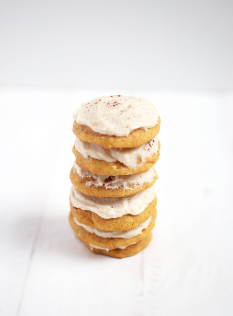 stack of 6 frosted soft pumpkin cookies