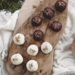 wood cutting board with gingersnap chocolate truffle balls on it
