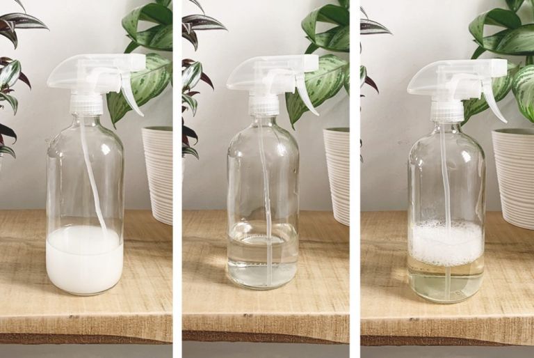 3 clear glass bottles filled with liquid on shelf