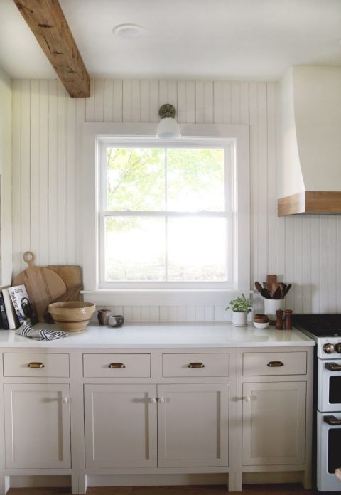 beadboard wall in kitchen with beige cabinets