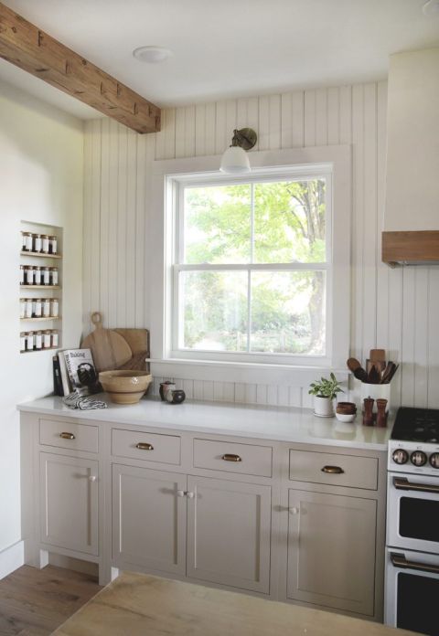 kitchen with beadboard backplash and beige cabinets