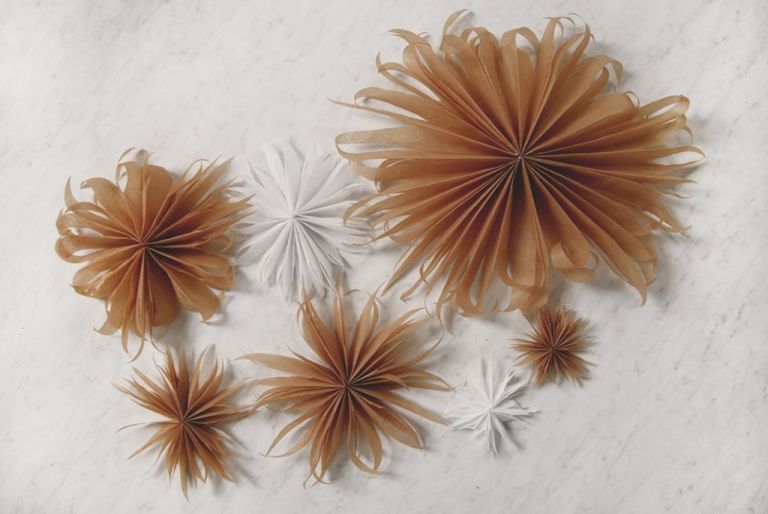 white and brown parchment paper stars on counter