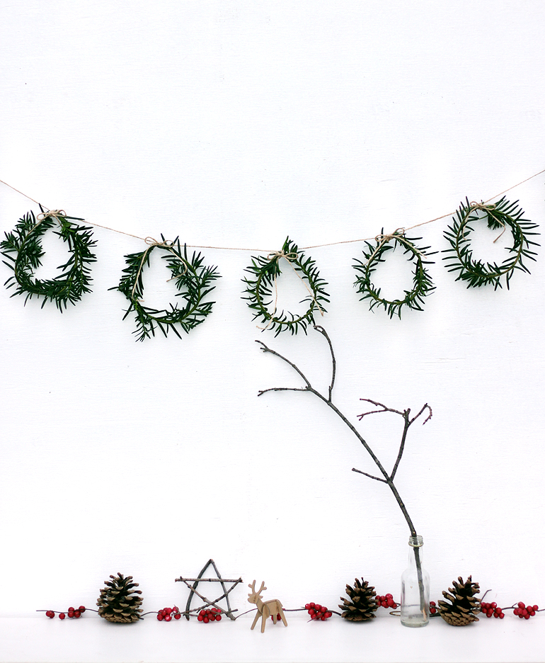 DIY Mini Wreath Garland | 50 Awesome DIY Yule Decorations and Craft Ideas You Can Make for the Winter Solstice