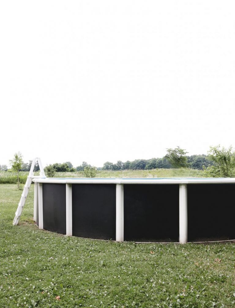 above ground swimming pool with painted black walls