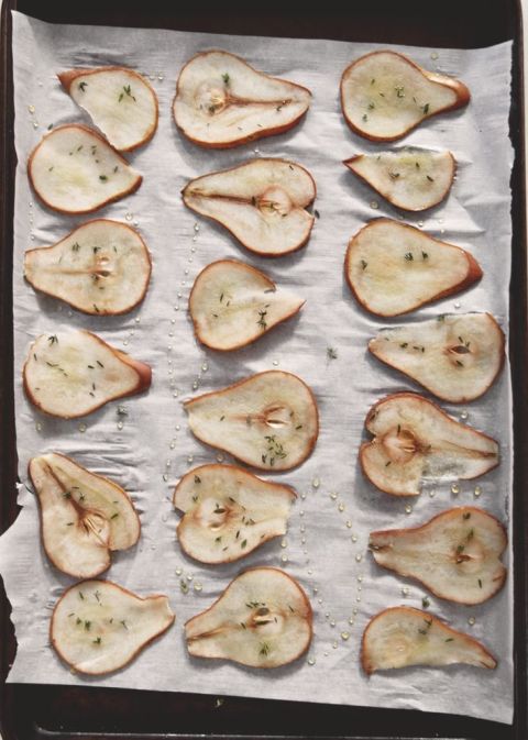 roasted pears with honey and honey on white parchment paper
