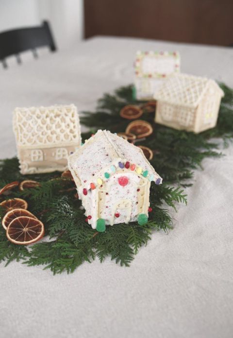 pop tart gingerbread houses on greenery with zestless oranges