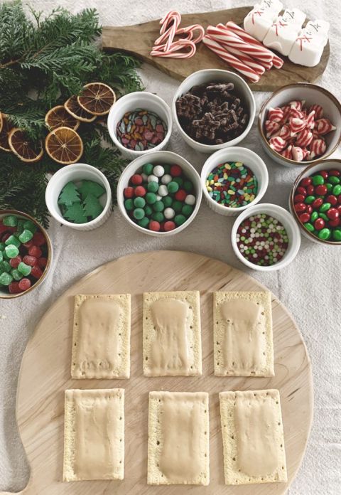 6 pop tarts on cutting board next to bowls of candy