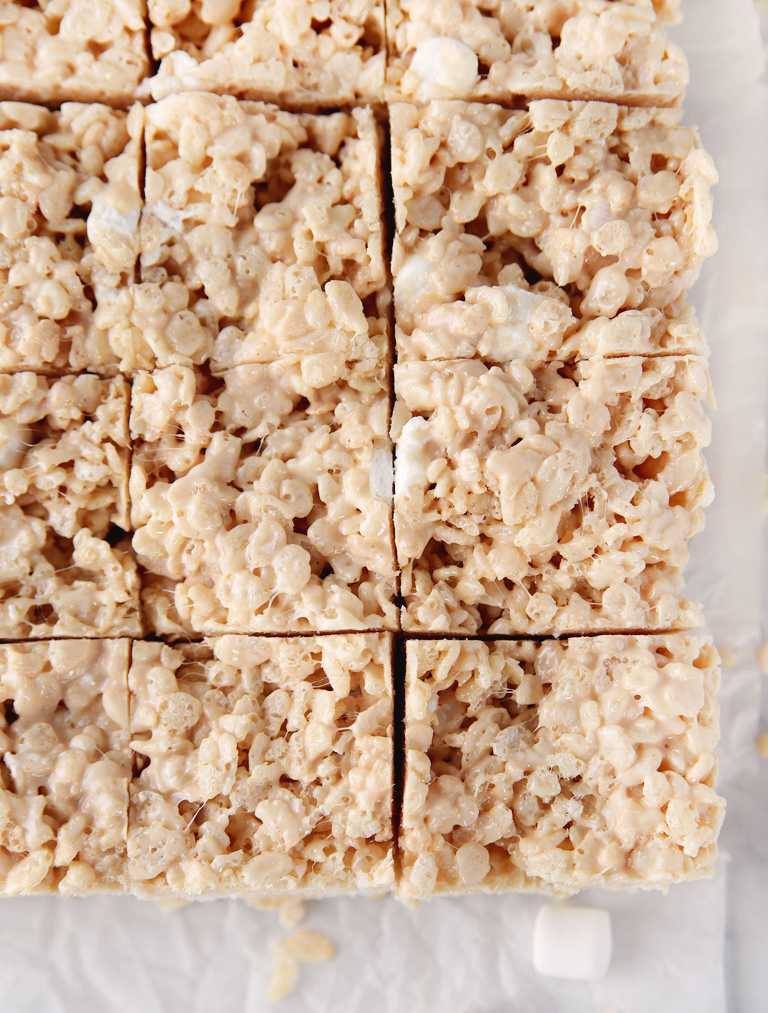 close up overhead shot of salted caramel rice krispie treats cut into squares