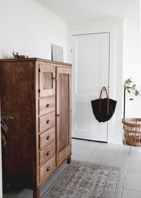 antique wood dresser in bedroom