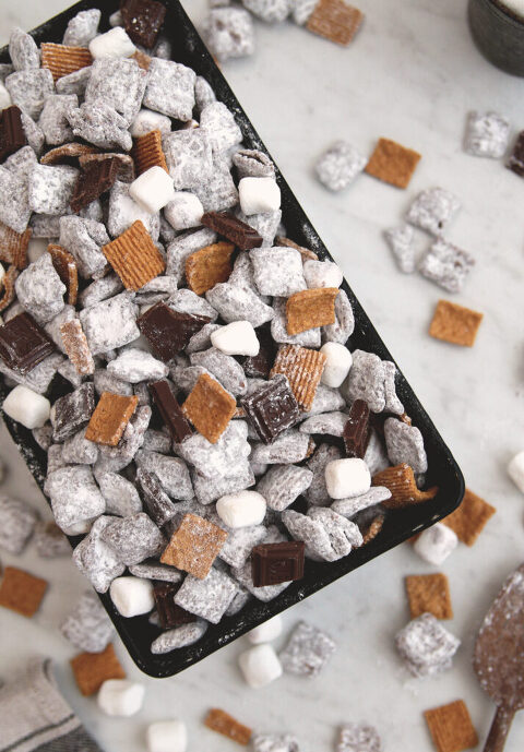 s'more puppy grub snack mix in loaf pan with cereal and marshmallows scattered virtually pan