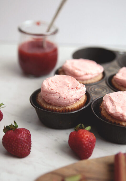 strawberry rhubarb cupcakes in a vintage metal muffin pan
