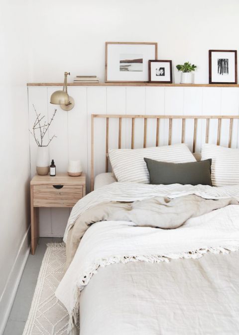 wood dowel bed next to wood nighstand