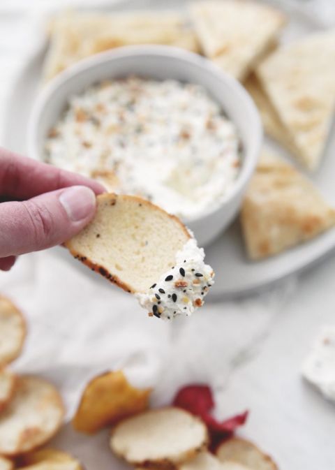 bagel chip with everything bagel dip on it