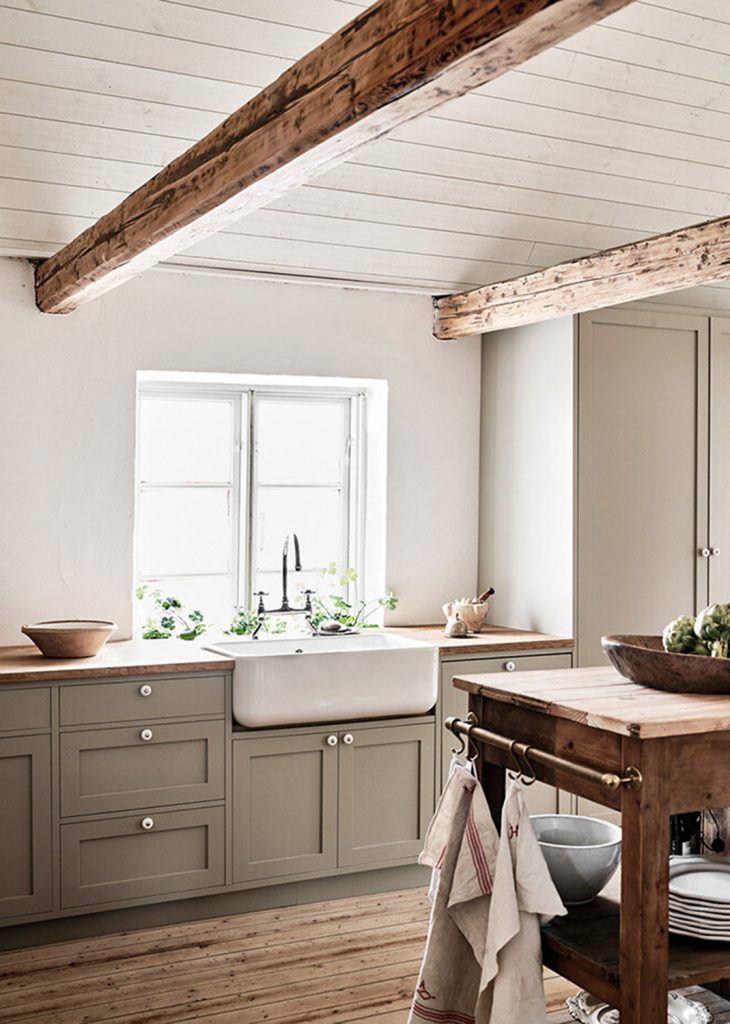 kitchen with wood beams and farmhouse sink