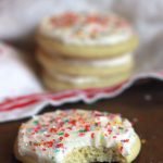 frosted cut out sugar cookies with bite out of it