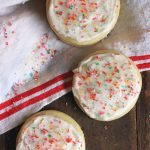 round cut out sugar cookie with frosting and sprinkles